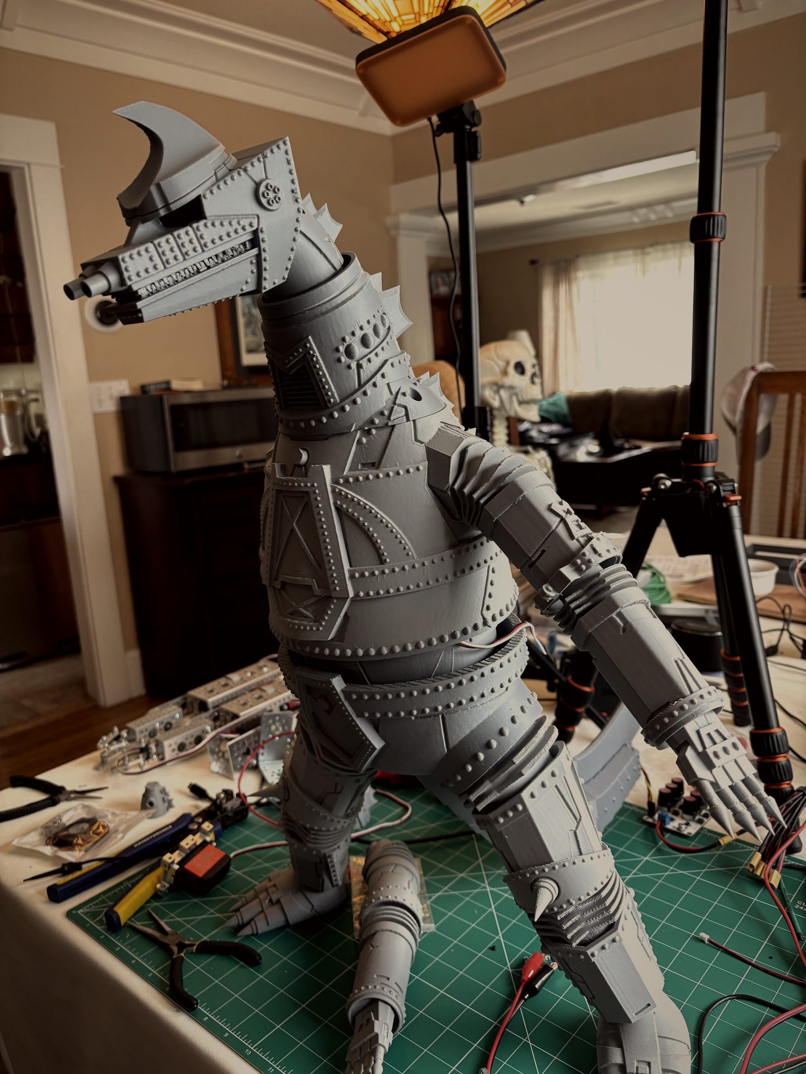 Fully assembled 3D-printed MechaGodzilla animatronic standing on the workbench